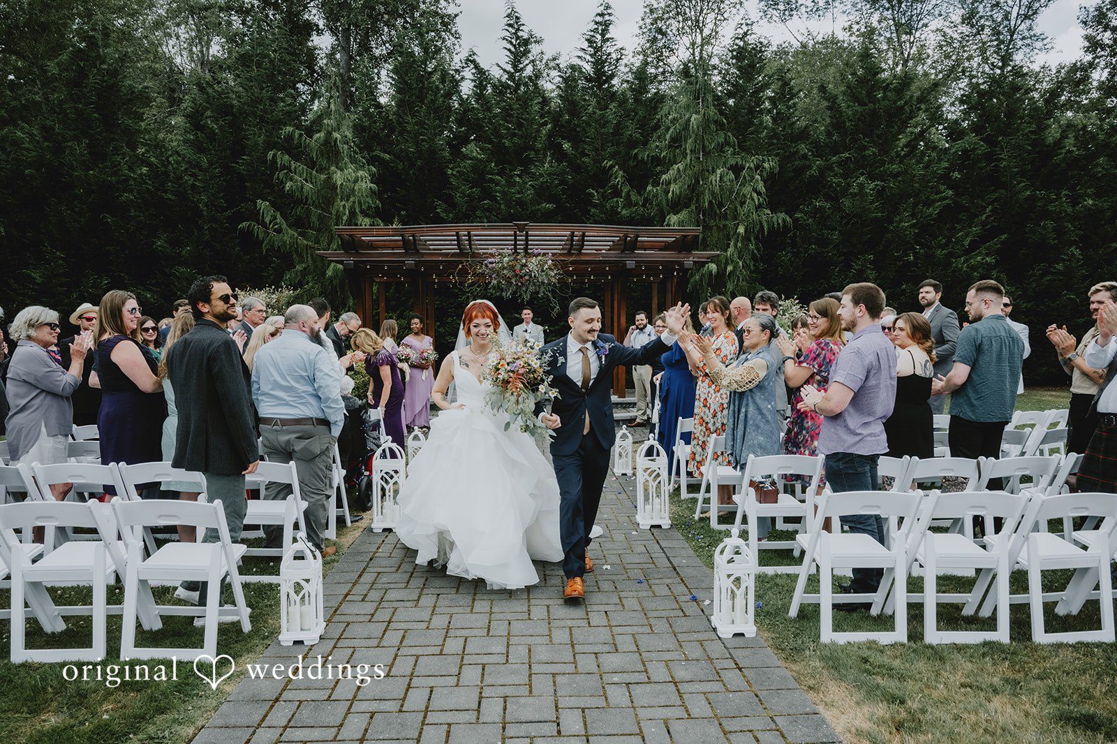 McKenna + Patrick Our Seattle wedding photographers captured the moment the couple made a joyful exit after their Five2Five wedding