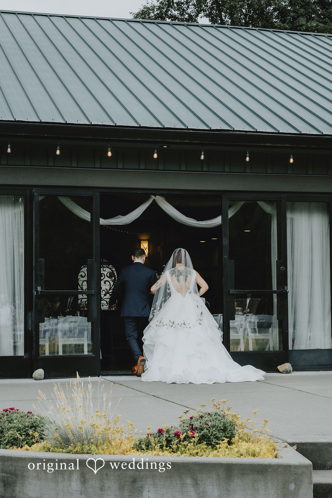 McKenna + Patrick The couple entering their wedding reception hall