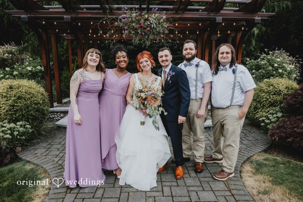 McKenna + Patrick Our Seattle wedding photographers captured a stunning portrait of the couple and their bridal party at The Five2Five
