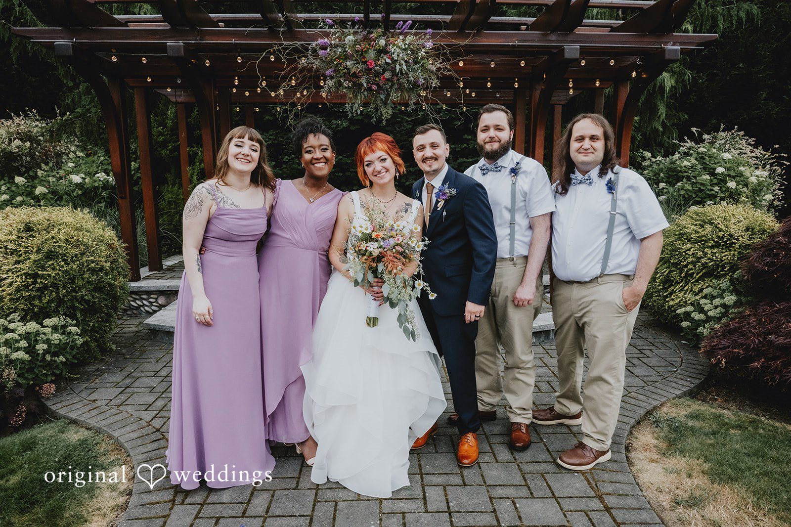 Our Seattle wedding photographers at Original Weddings captured a stunning portrait of the couple and their bridal party at The Five2Five