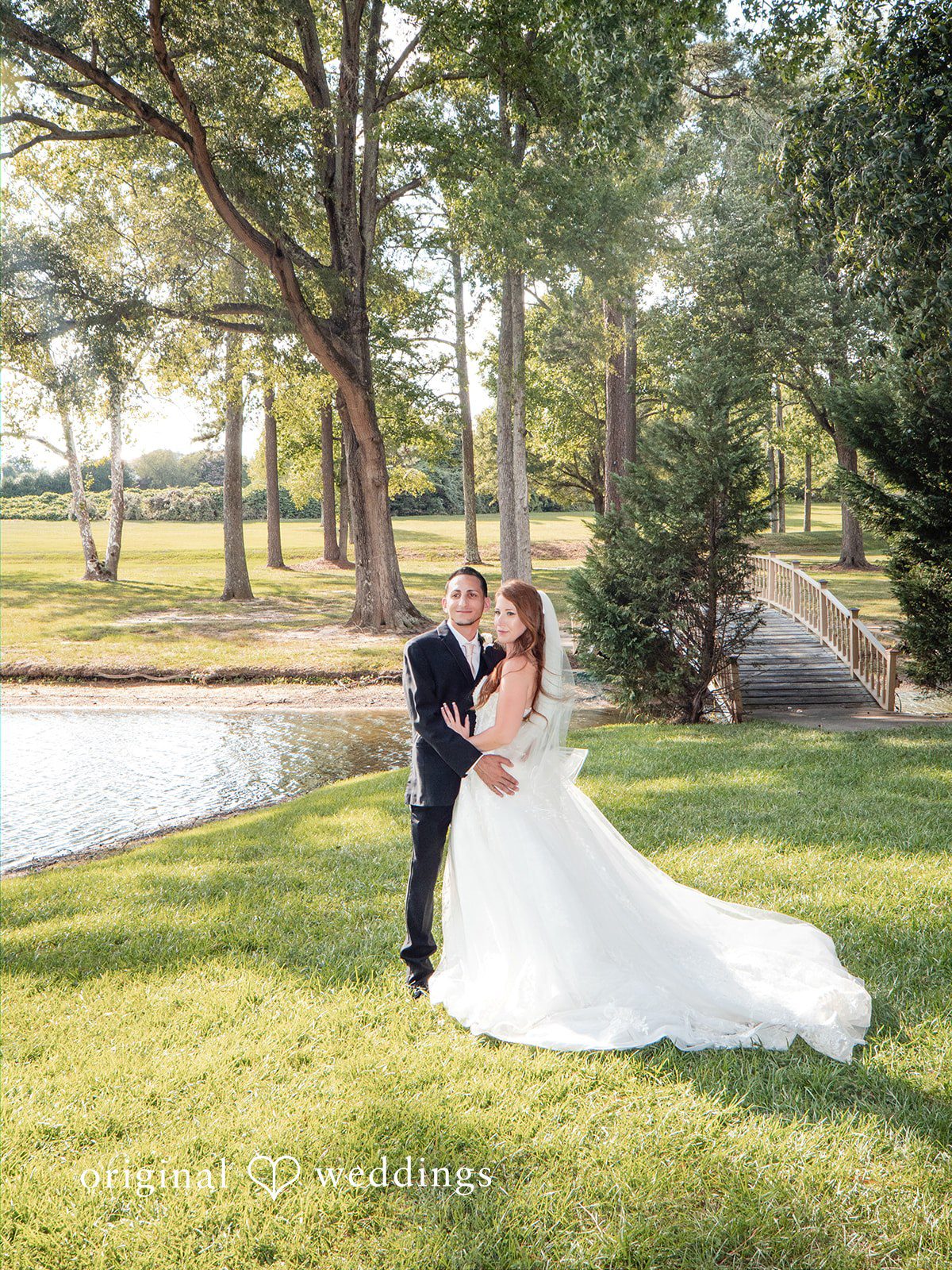 Vincenzo + Kristin Stunning Portrait of couple at The Montague Lake Pavilion by Raleigh Wedding Photographers from Original Weddings.