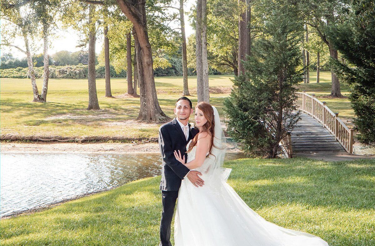 Stunning Portrait of couple at The Montague Lake Pavilion by Raleigh Wedding Photographers from Original Weddings.