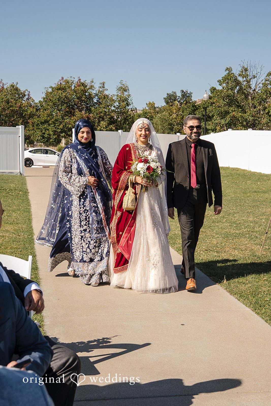 Neha + Andrew The bride's parents escort the bride down the aisle