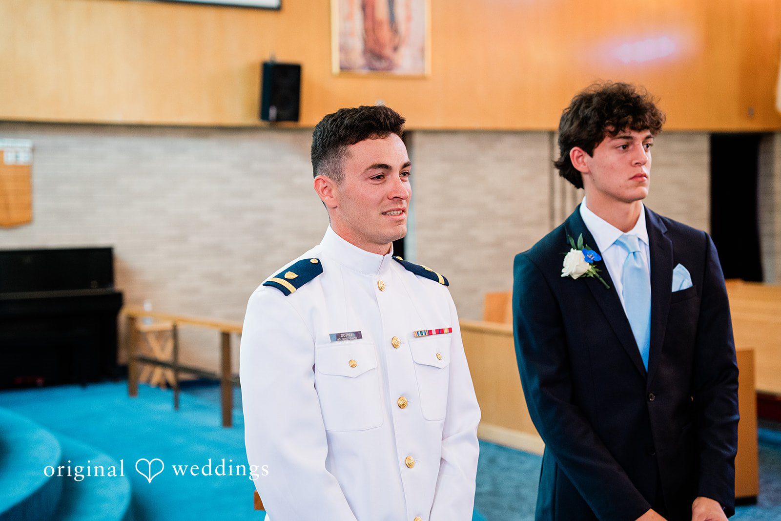 Veronica + Wyatt A groom in a white military uniform standing alongside a groomsman in a black suit.