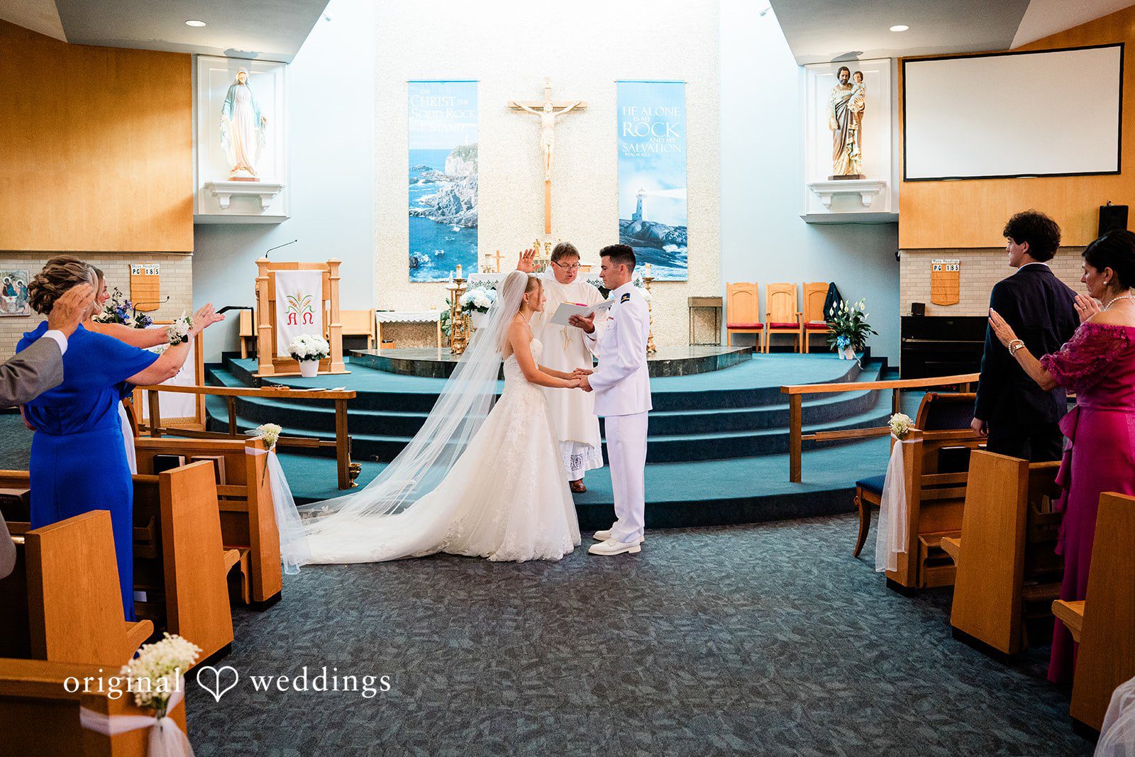 Veronica + Wyatt A bride and groom standing together on the altar.