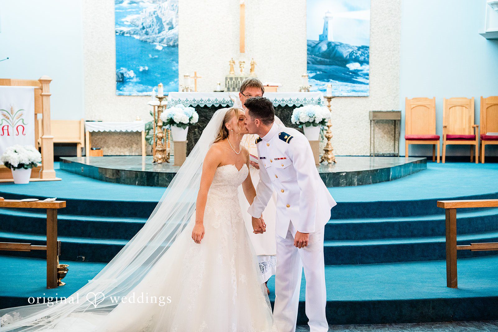 Veronica + Wyatt A bride and groom share first kiss after the ceremony.