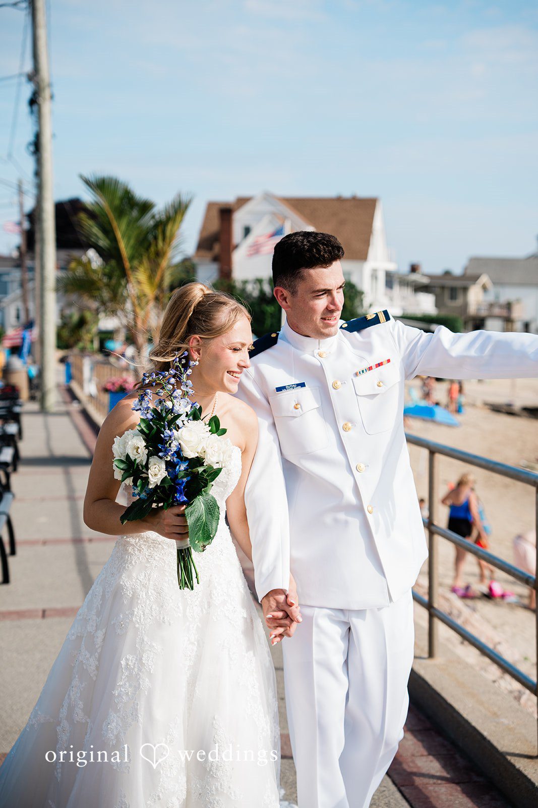 Veronica + Wyatt A bride holding a bouquet while standing next to the groom in a white uniform.