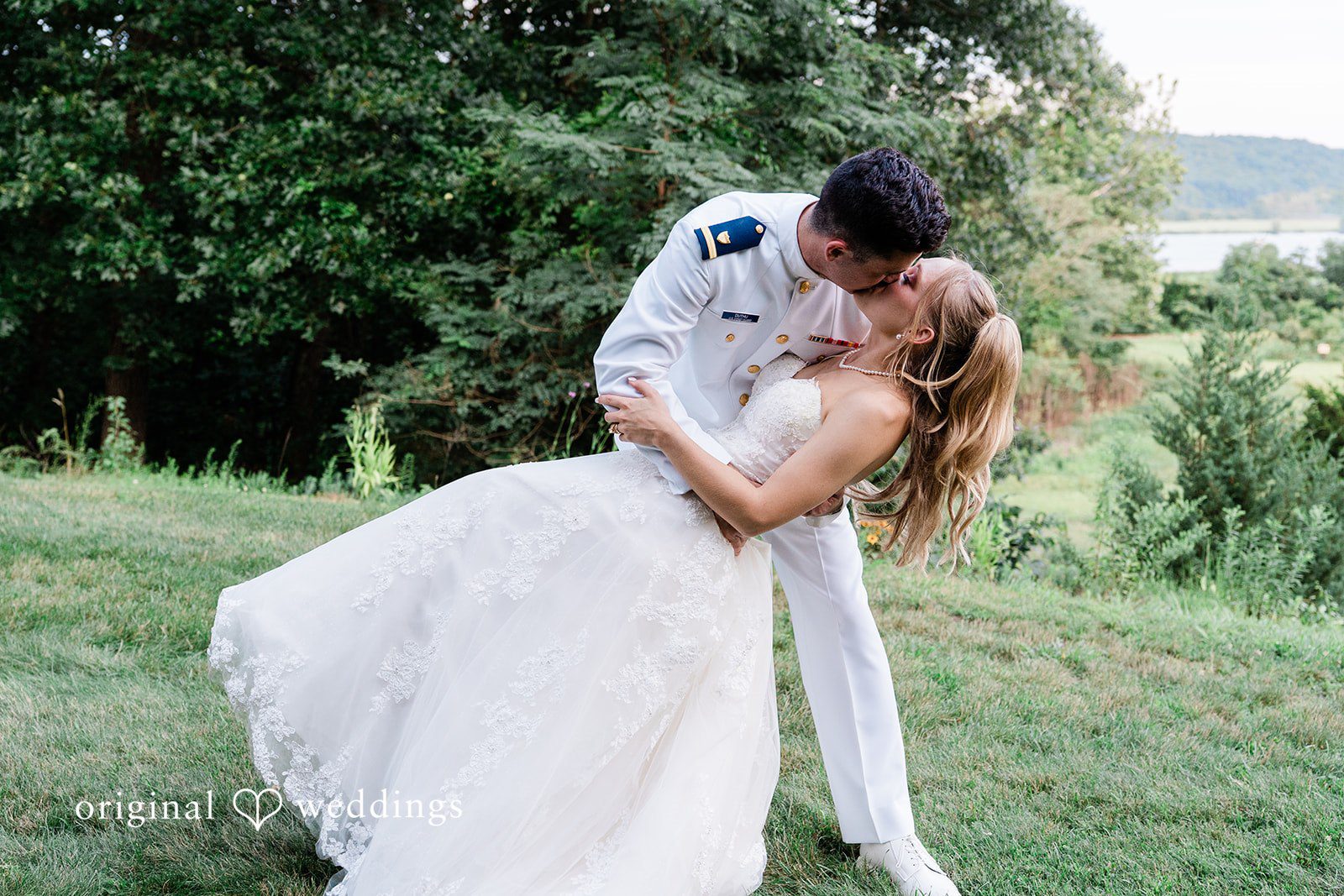 Veronica + Wyatt A groom lifting and dipping the bride during a romantic embrace.