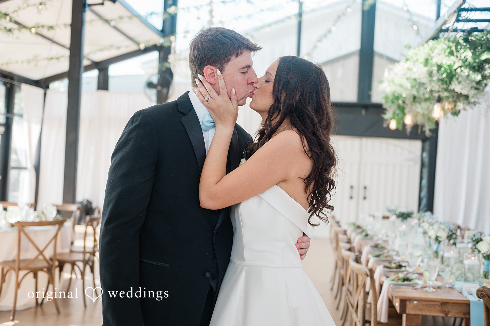 Paige + Stephen A bride and groom kissing each other.