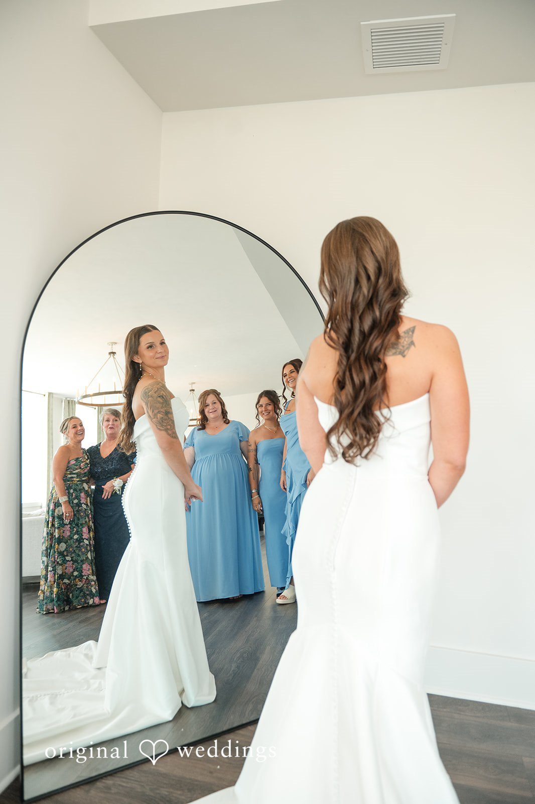 Jaclyn + Mason Bride in her wedding dress viewed through a mirror reflection.