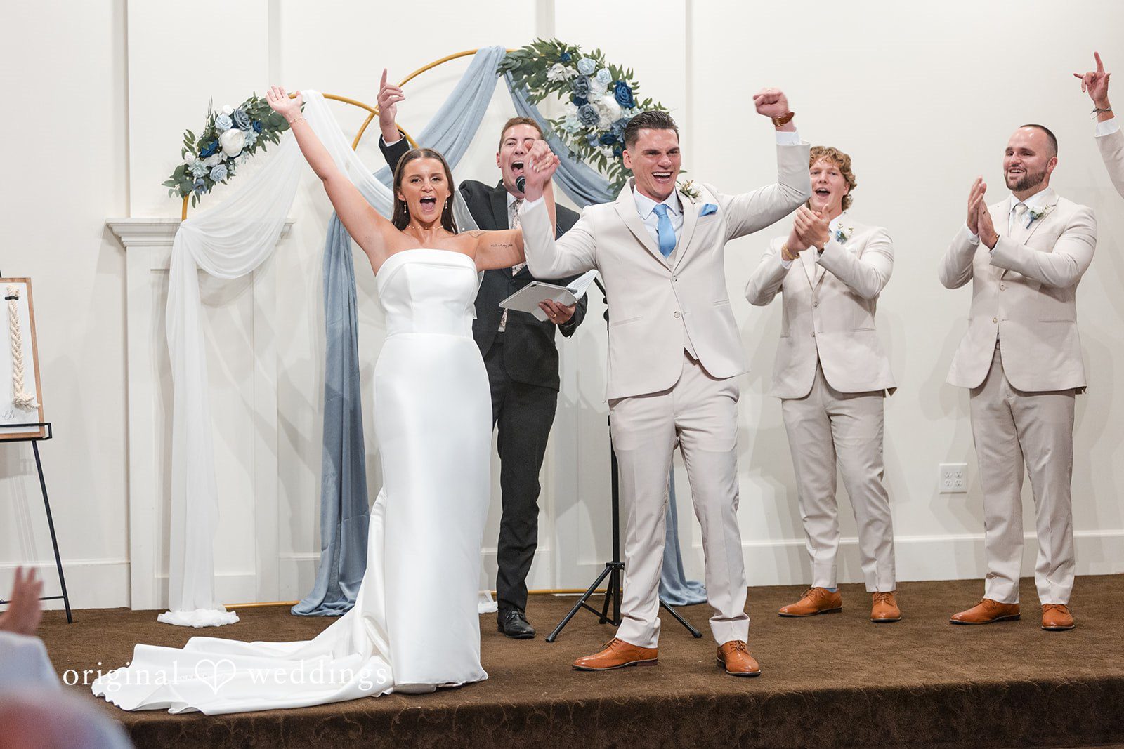Jaclyn + Mason Bride and groom celebrating with their wedding party.