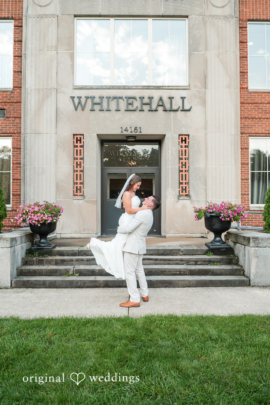 Jaclyn + Mason Bride spinning her dress in front of a brick building.