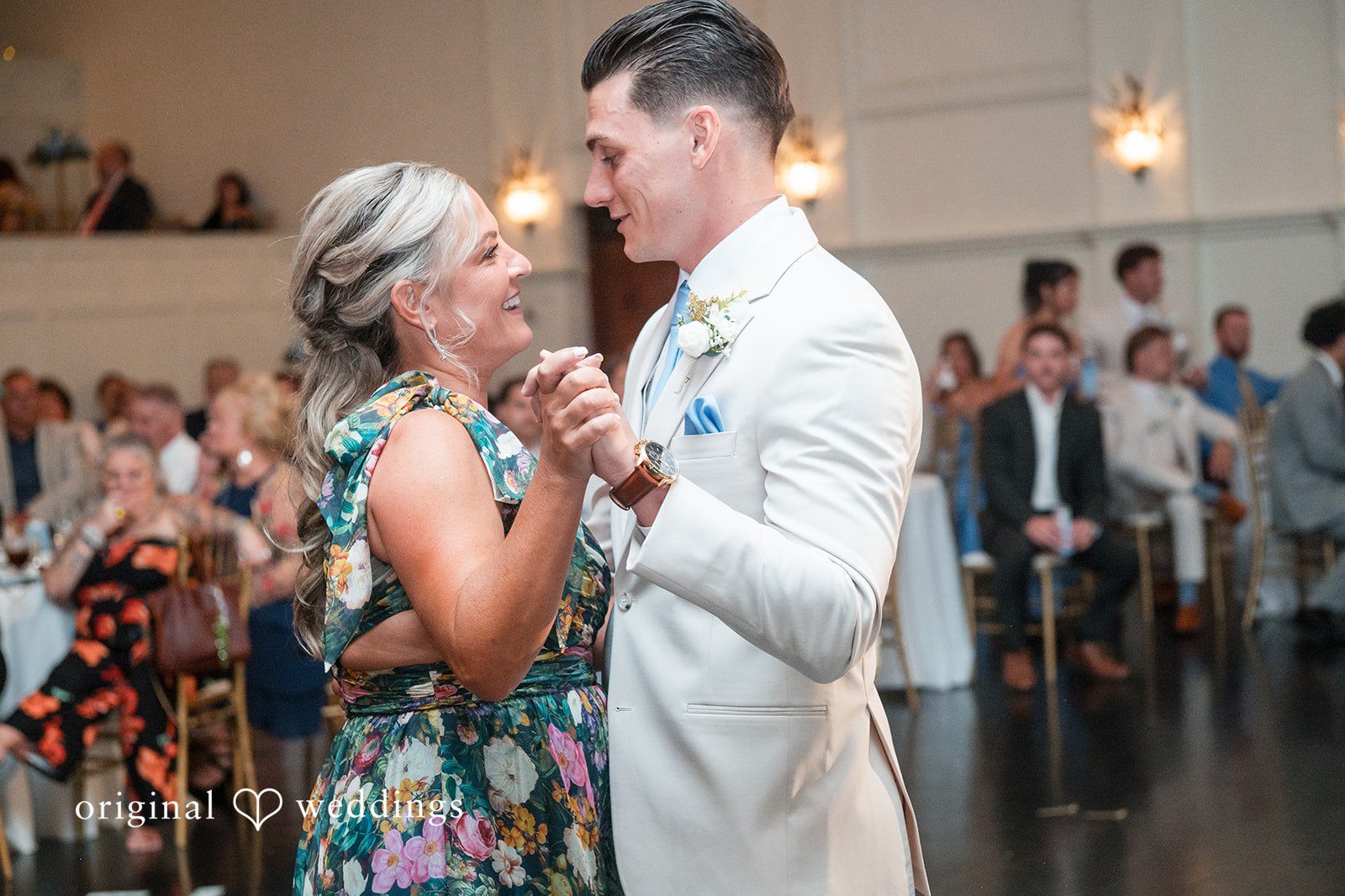 Jaclyn + Mason A groom and women laughing together while slow dancing.