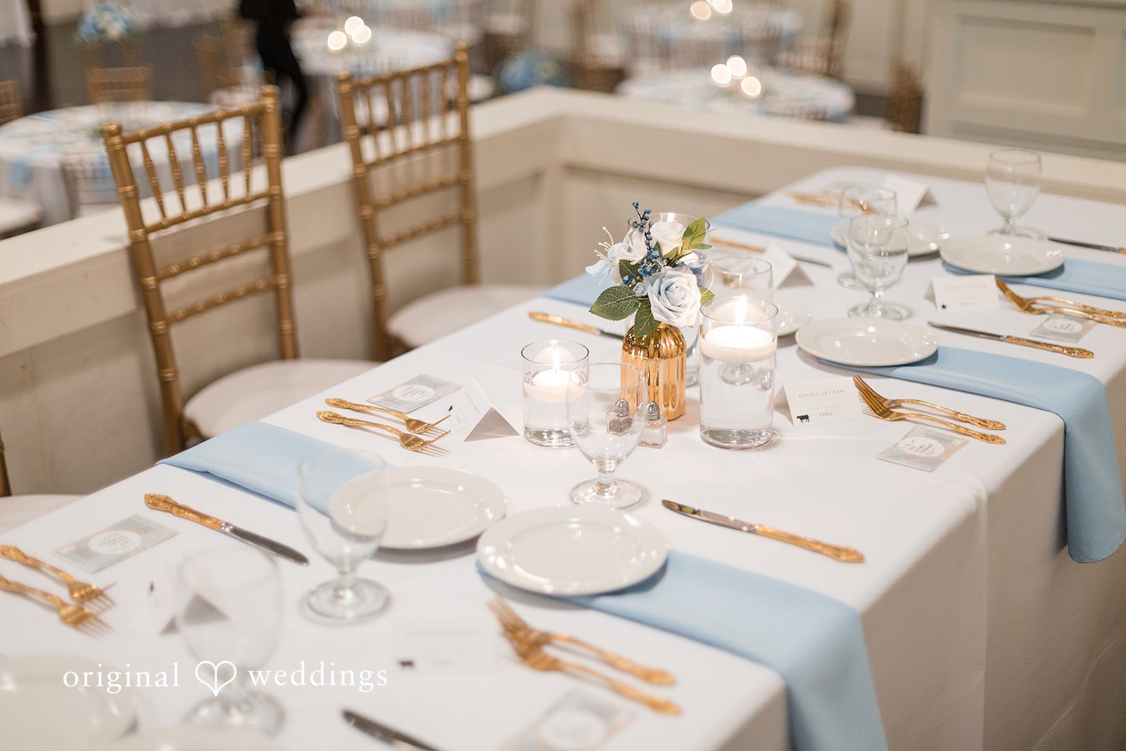 Jaclyn + Mason Long table set with white tableware, napkins, and candles.