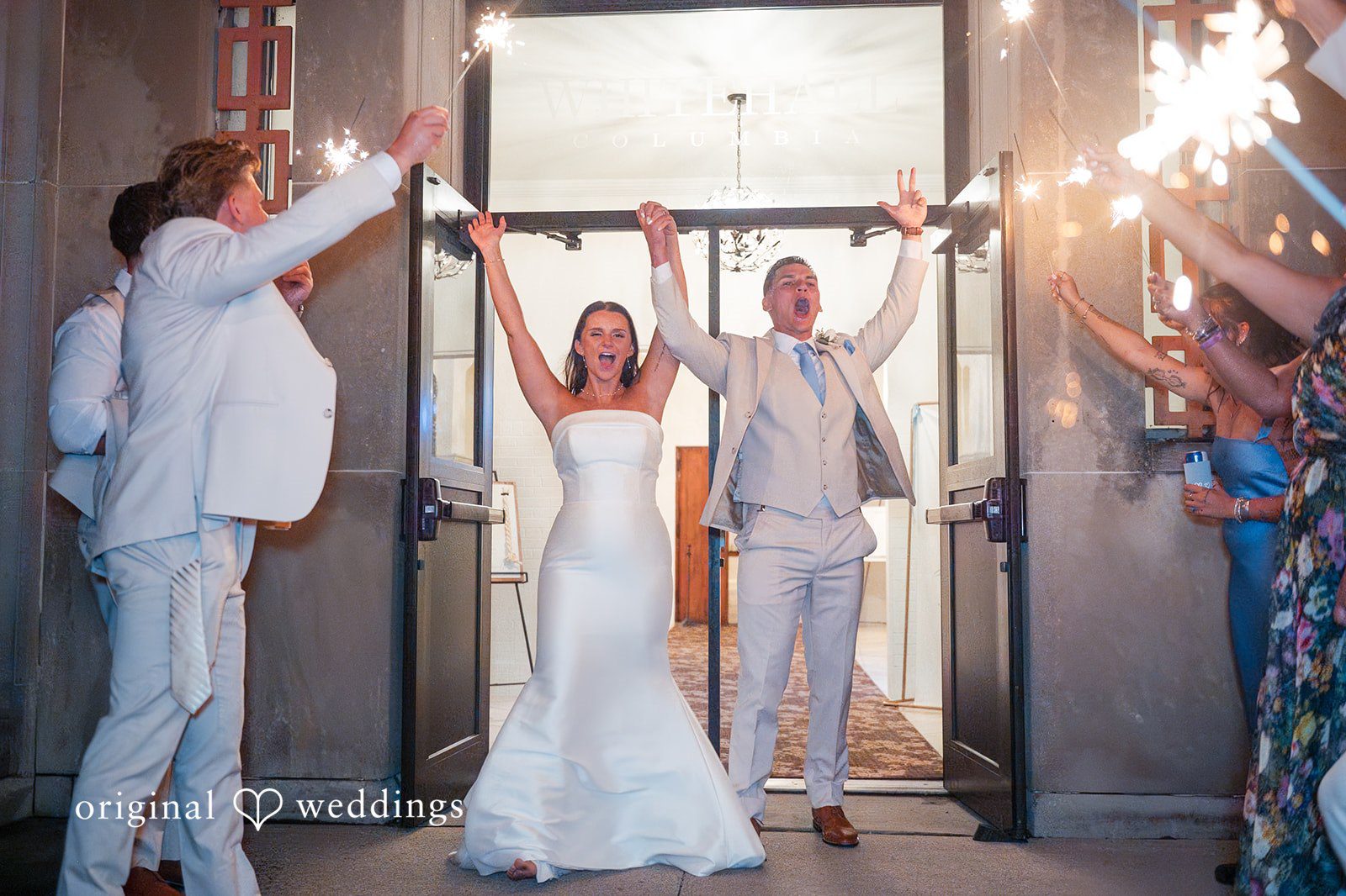 Jaclyn + Mason Bride and groom making their grand exit through a doorway