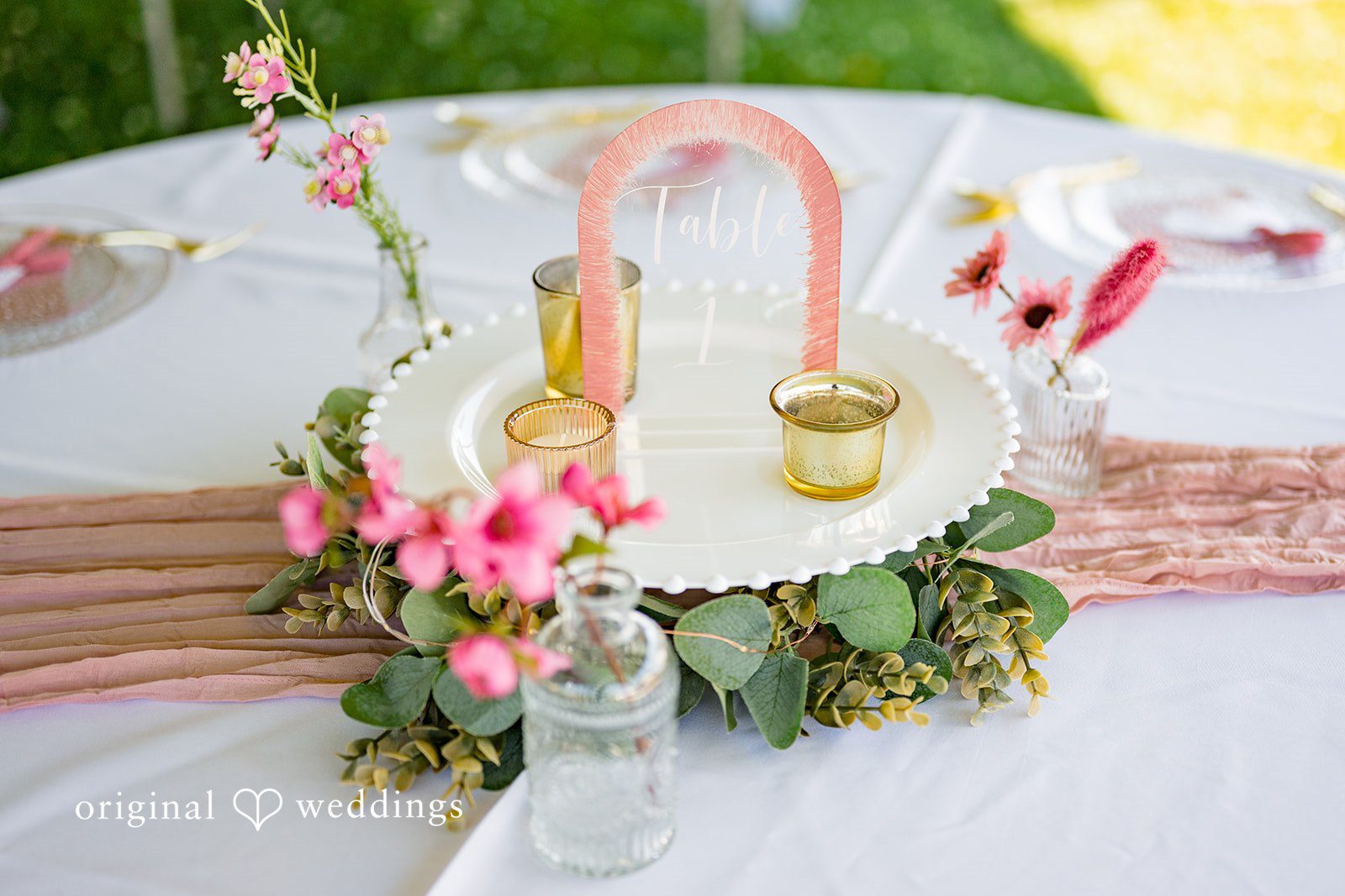 Melayna + Harley A decorated wooden basket sits on a reception table.
