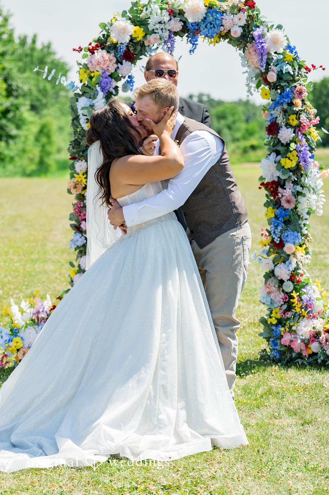 Melayna + Harley A bride and groom embrace during their ceremony.