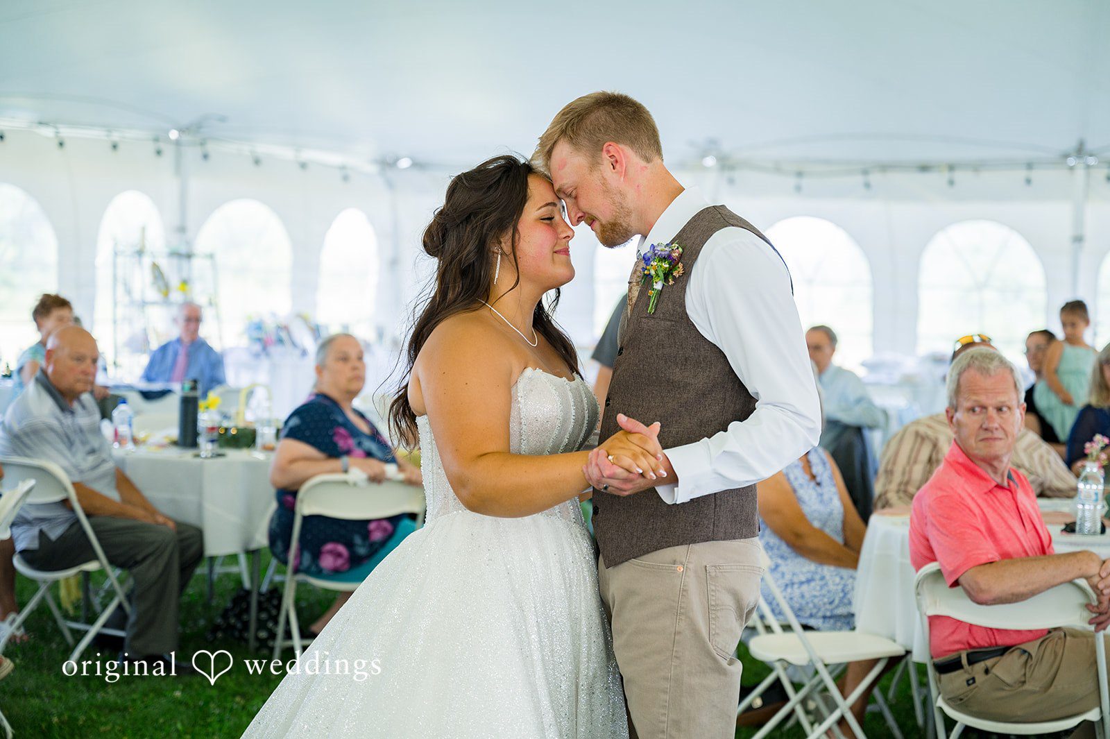 Melayna + Harley A bride and groom share a moment during their reception.