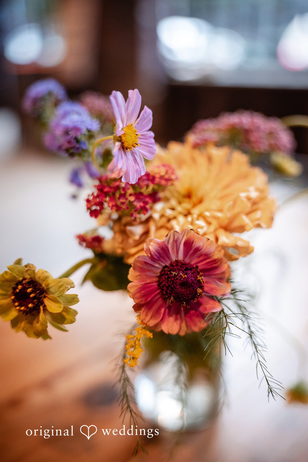 Claudio + Claire Colorful wildflowers in a glass vase