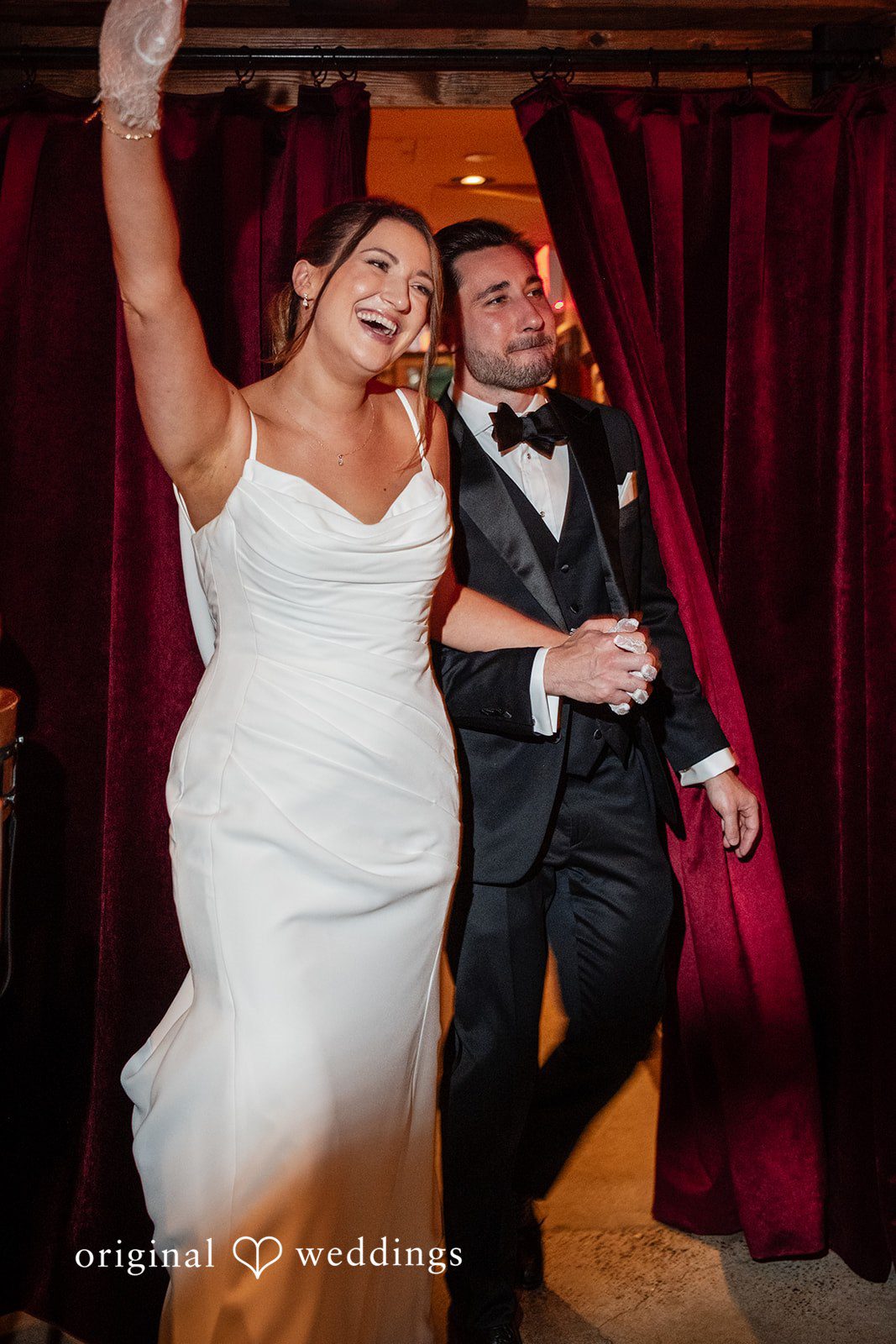 Claudio + Claire Grand entrance through the red curtains at Ainslie