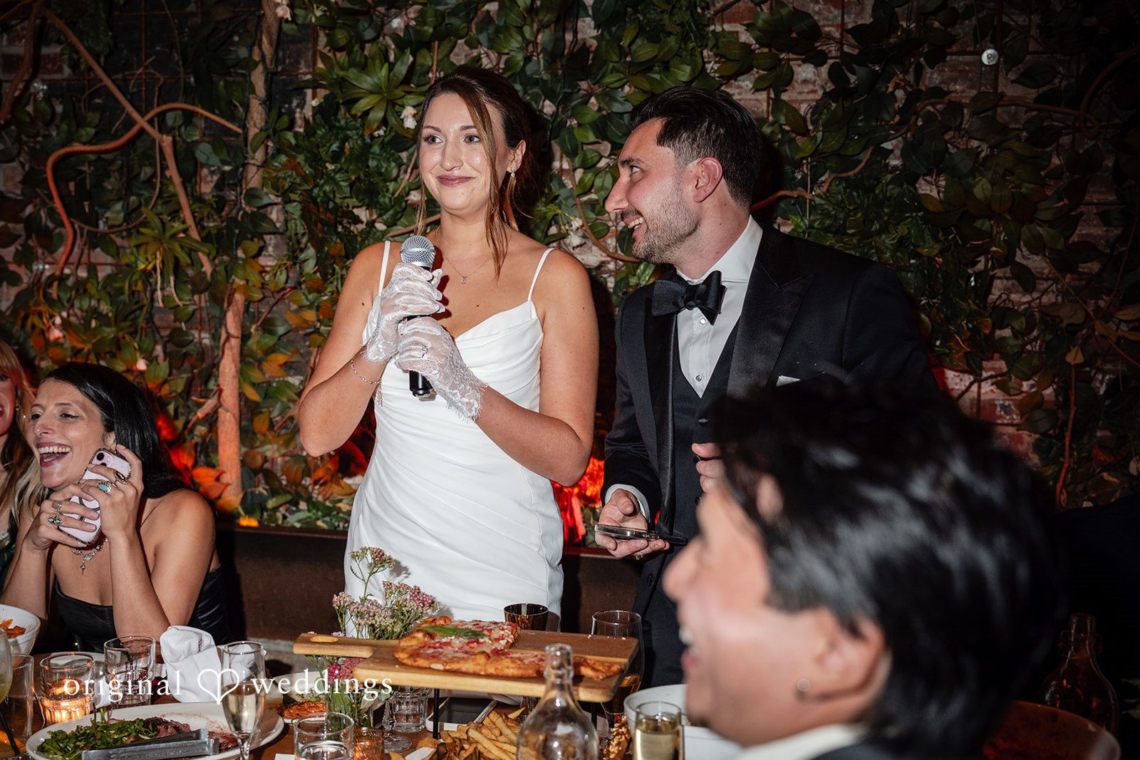 Claudio + Claire Couple raising a toast at Ainslie