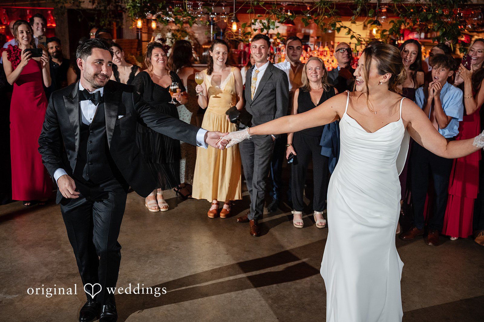 Claudio + Claire Bride and groom dancing into the room at Ainslie