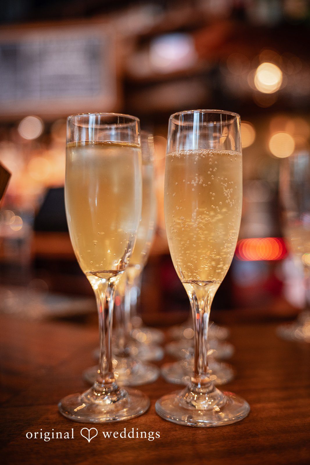 Claudio + Claire Champagne glasses ready for the toast