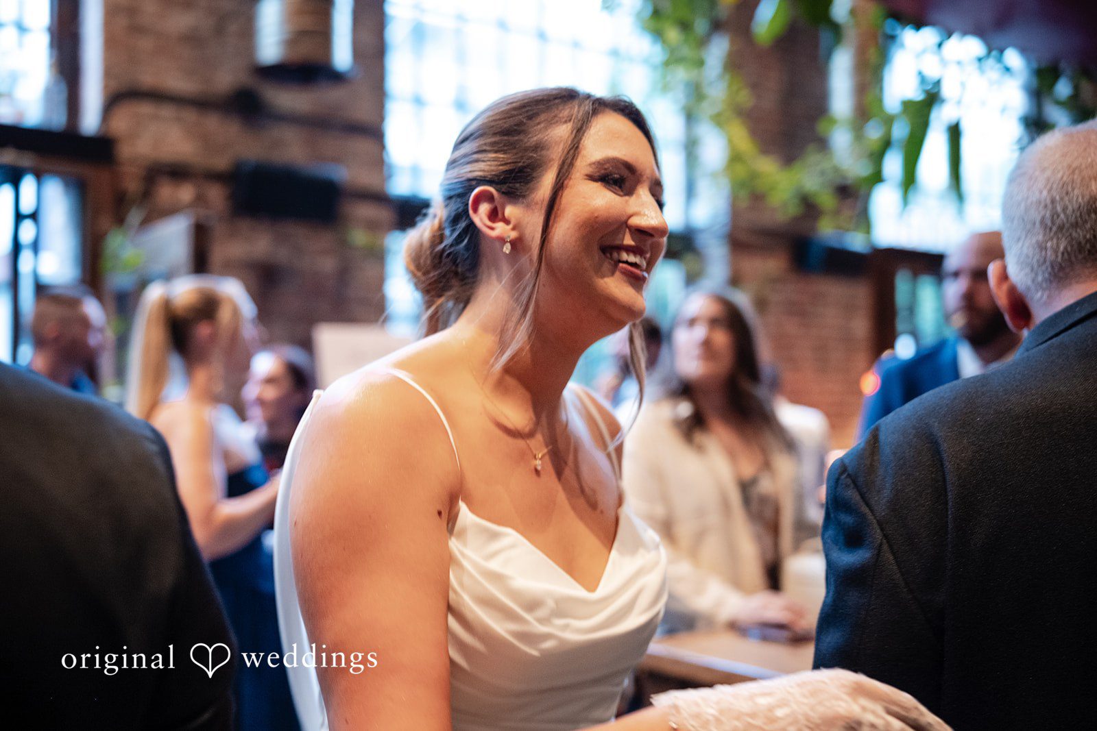 Claudio + Claire Bride smiling during the reception