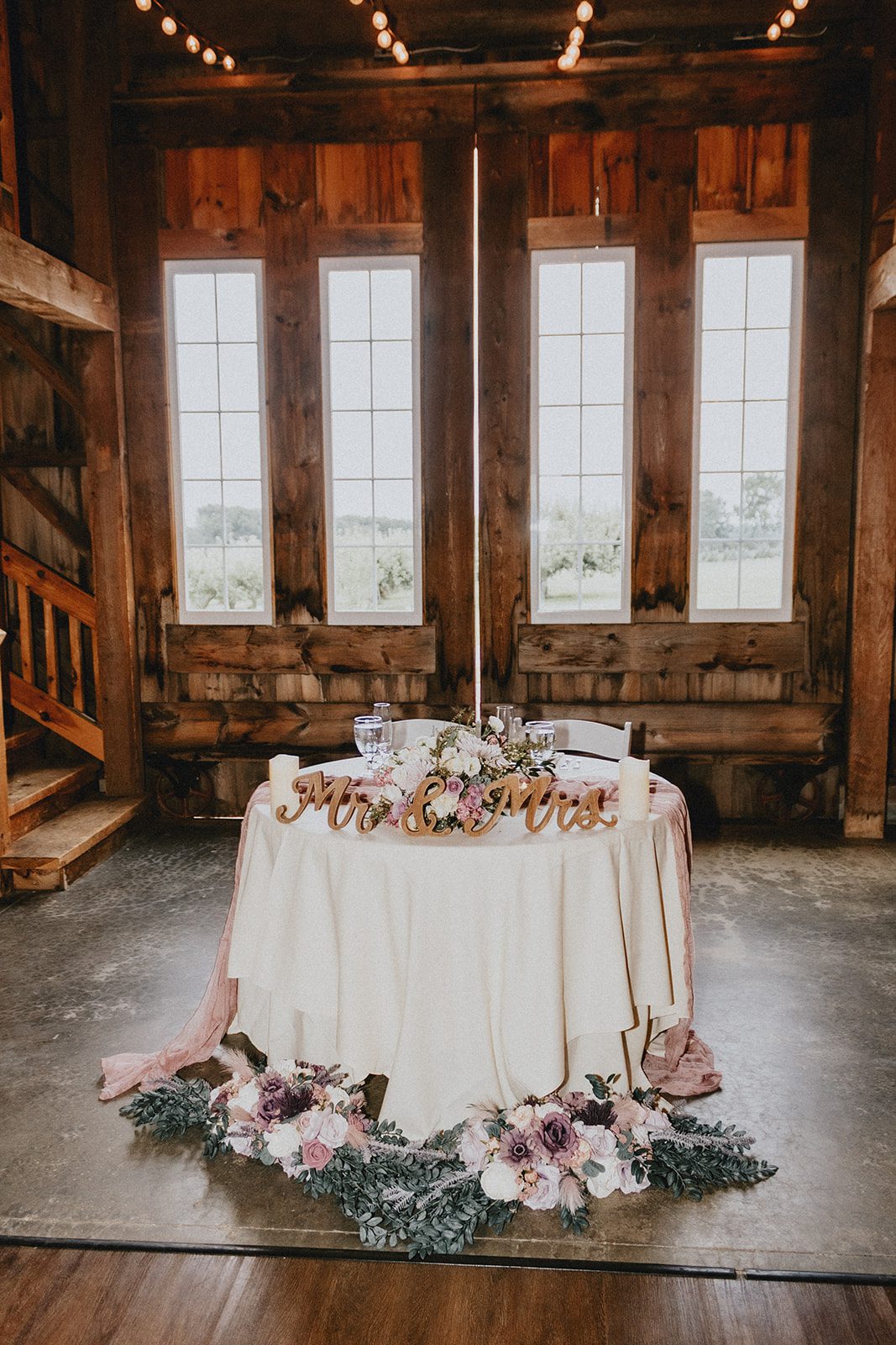 Barn reception with a sweetheart table at Allen Hill Farm Barn reception with a sweetheart table at Allen Hill Farm