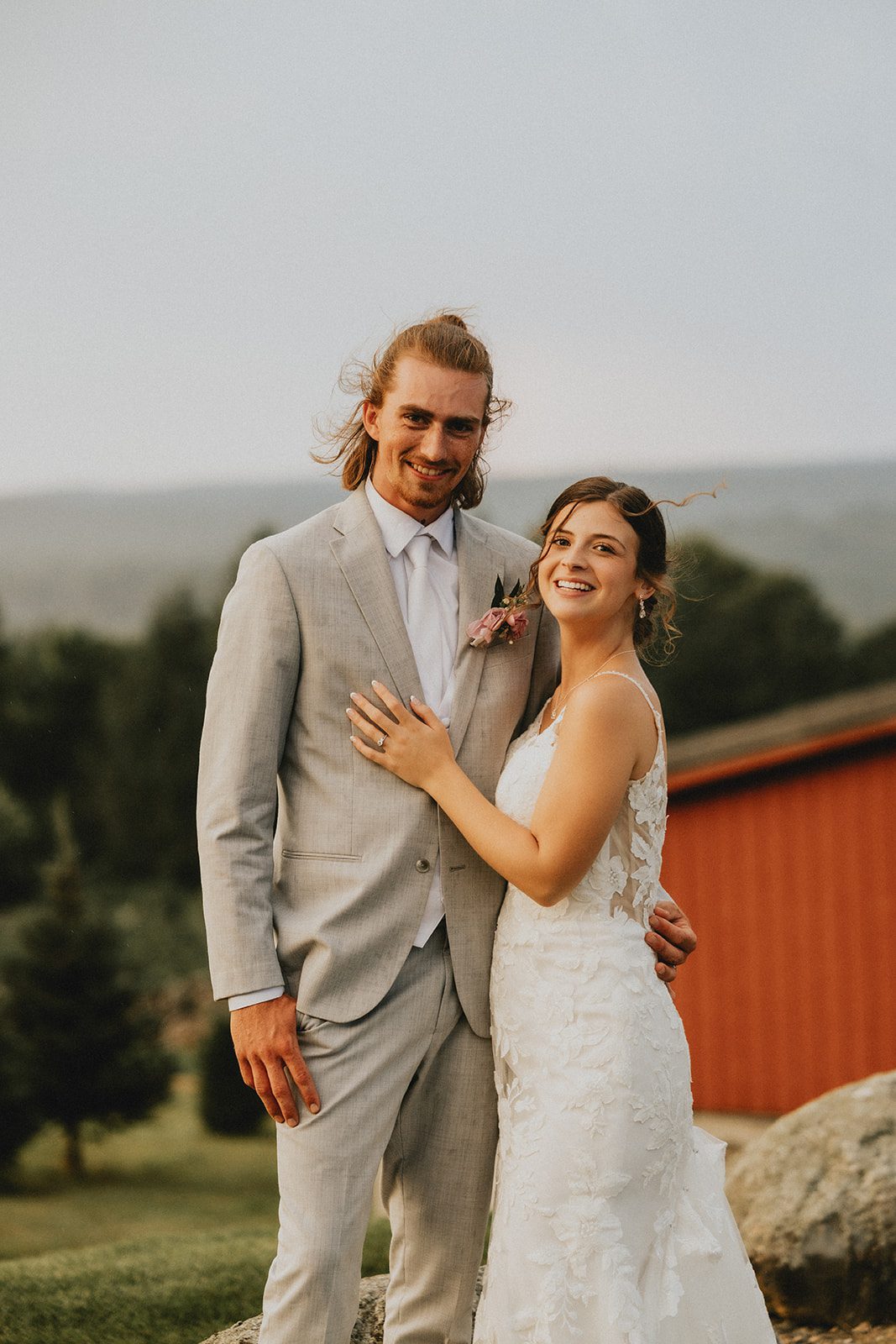 Couple in front of the red barn at Allen Hill Farm Couple in front of the red barn at Allen Hill Farm