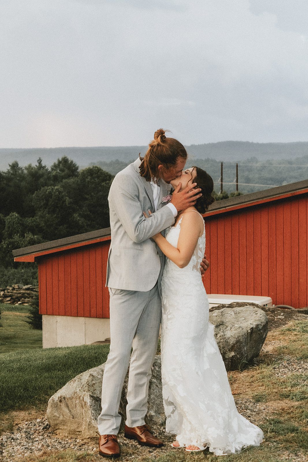 Bride and groom by the red barn Bride and groom by the red barn