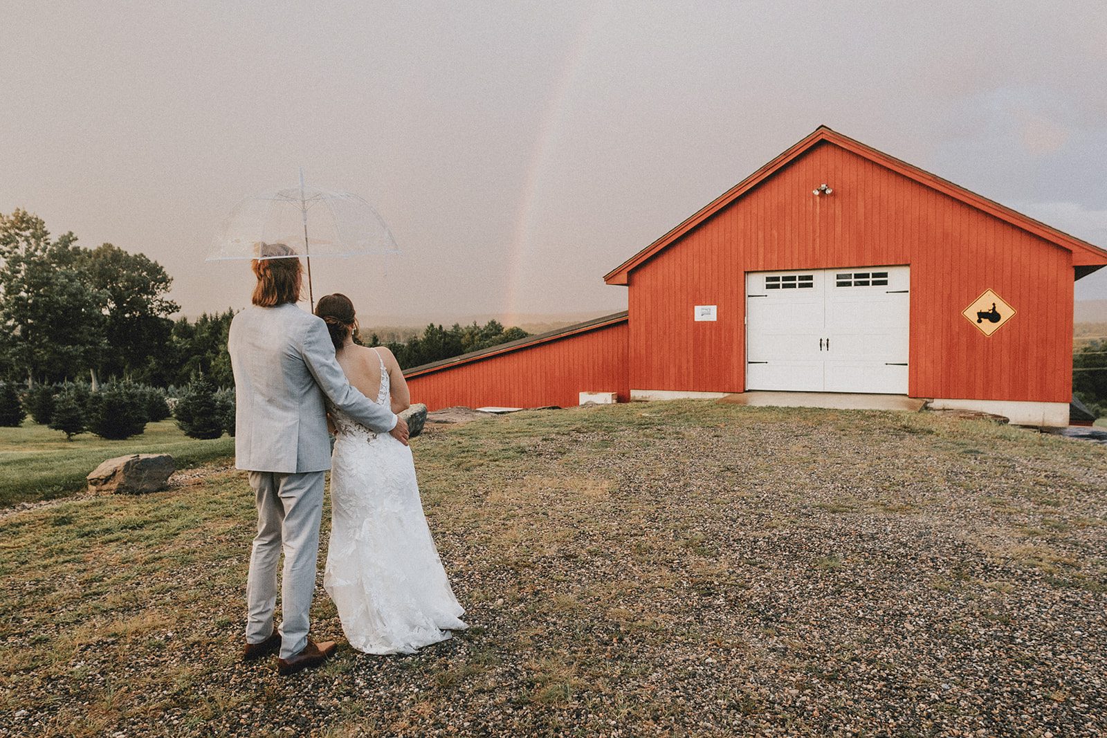 Couple walking toward the red barn at Allen Hill Farm Couple walking toward the red barn at Allen Hill Farm