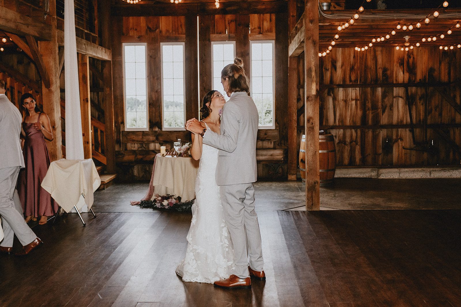 Couple inside the barn reception Couple inside the barn reception