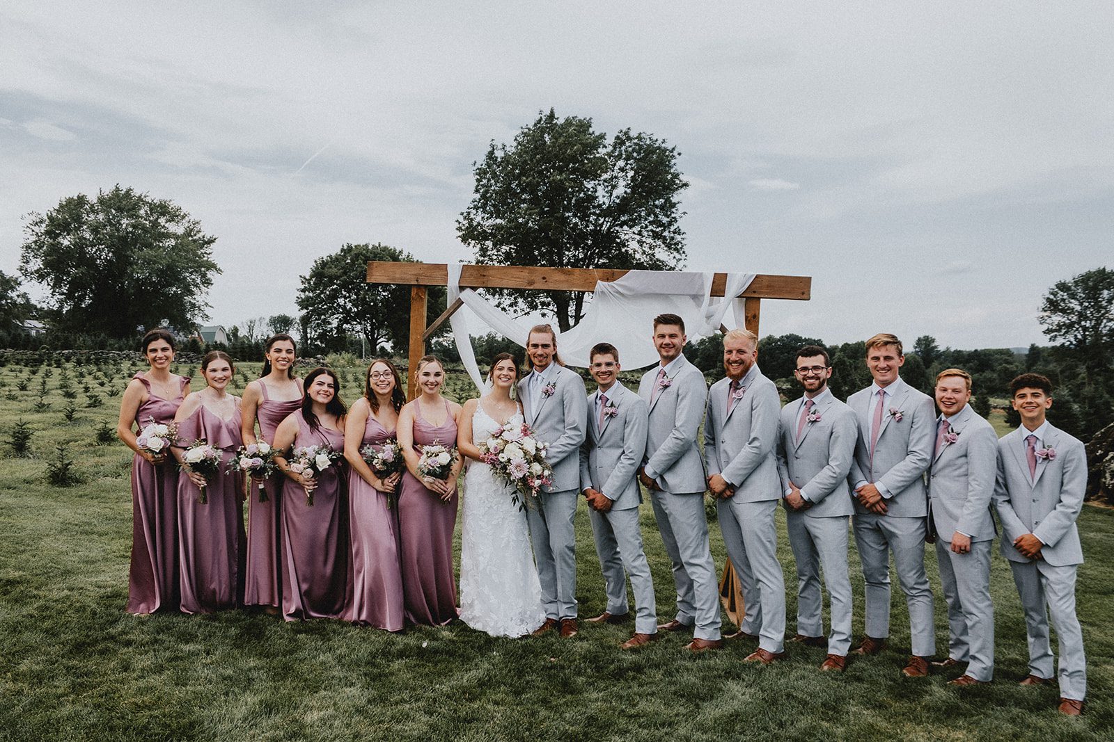 Full wedding party in the field Full wedding party in the field