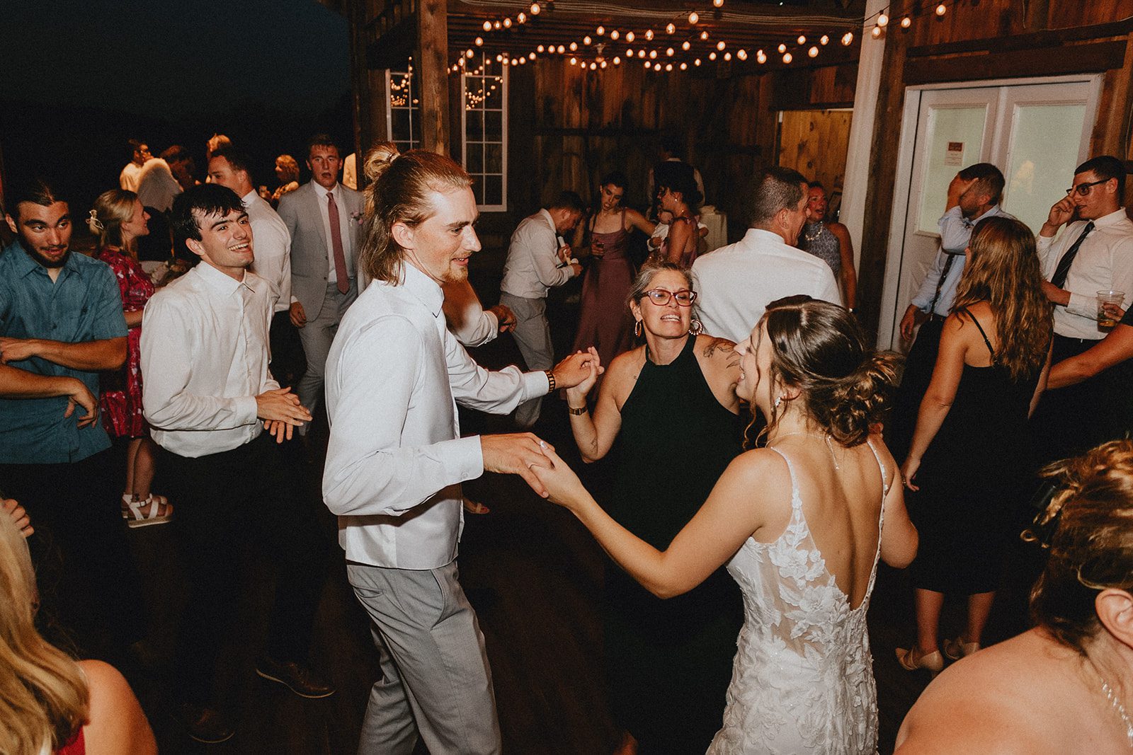 Guests dancing in the barn Guests dancing in the barn