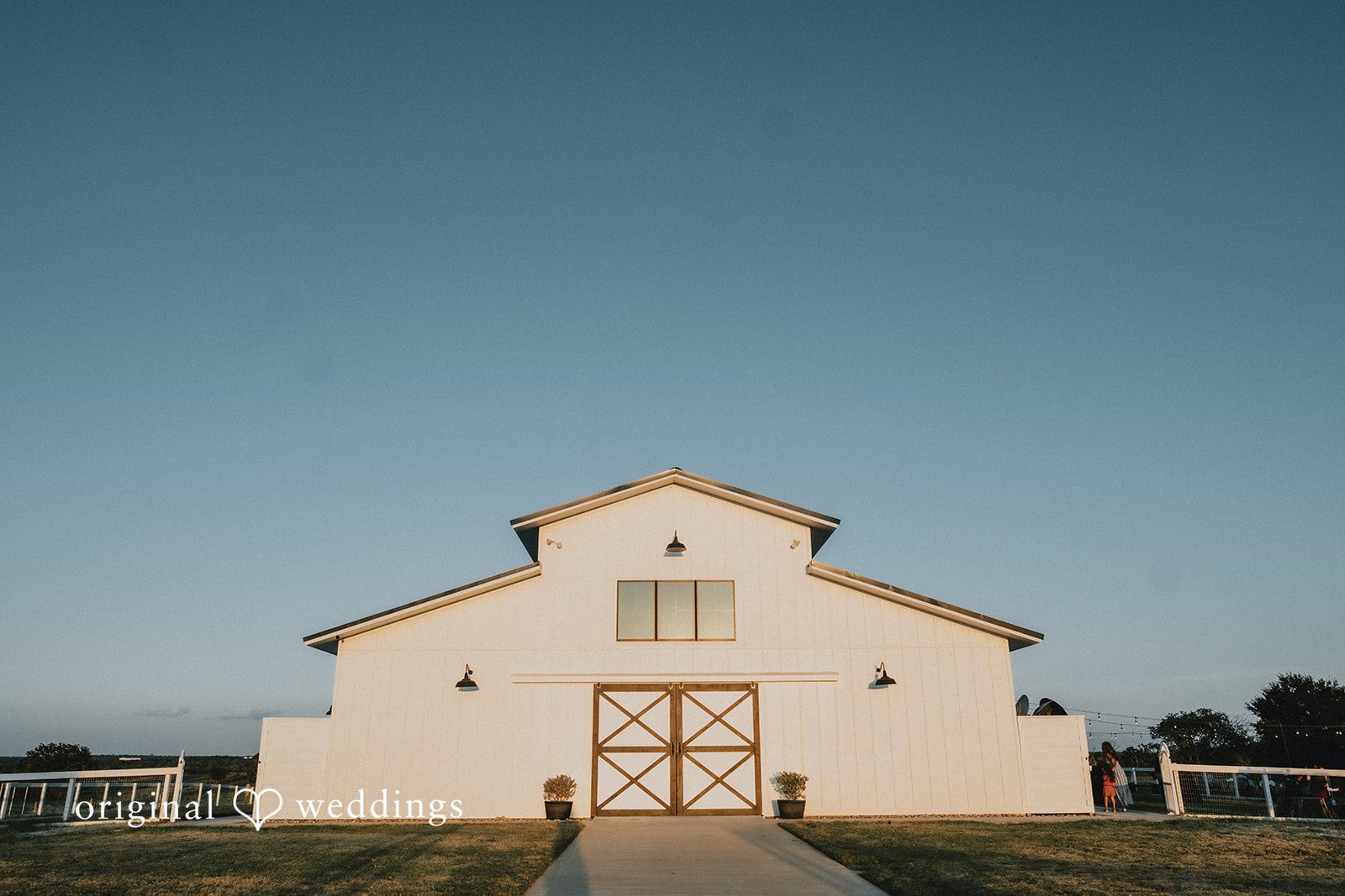 Briana + Joshua White barn at sunset by Austin wedding photographers at Always Timeless Barn