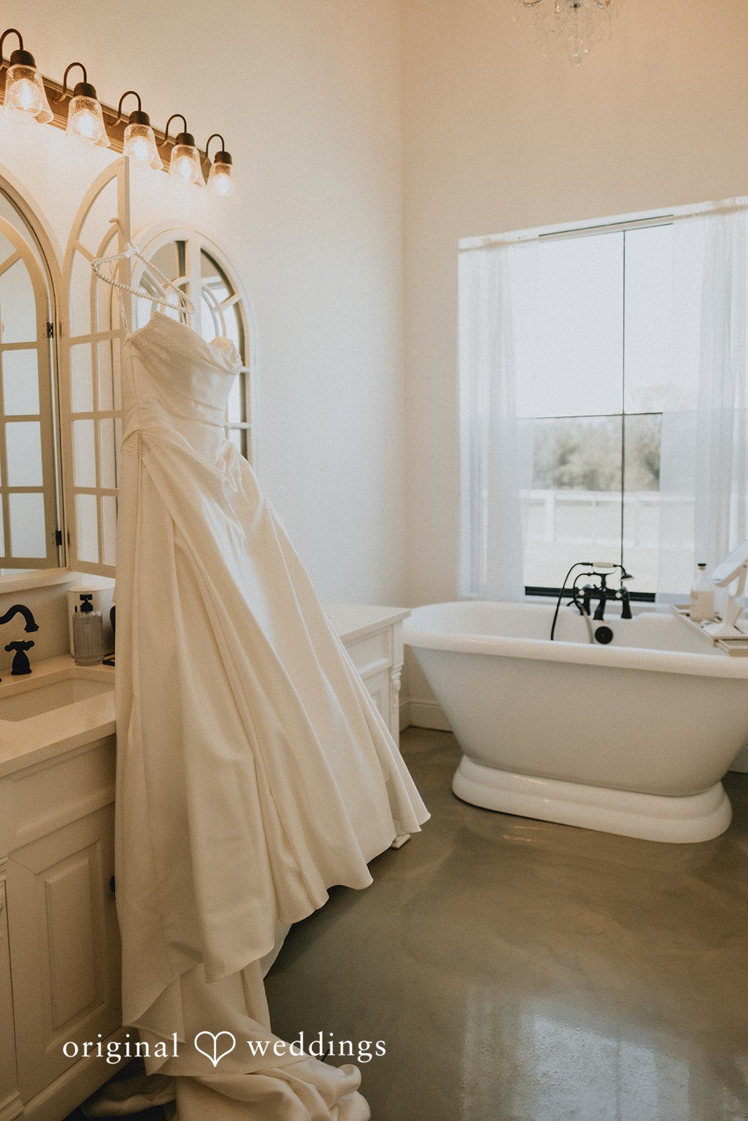 Briana + Joshua Gown hanging in the bridal suite
