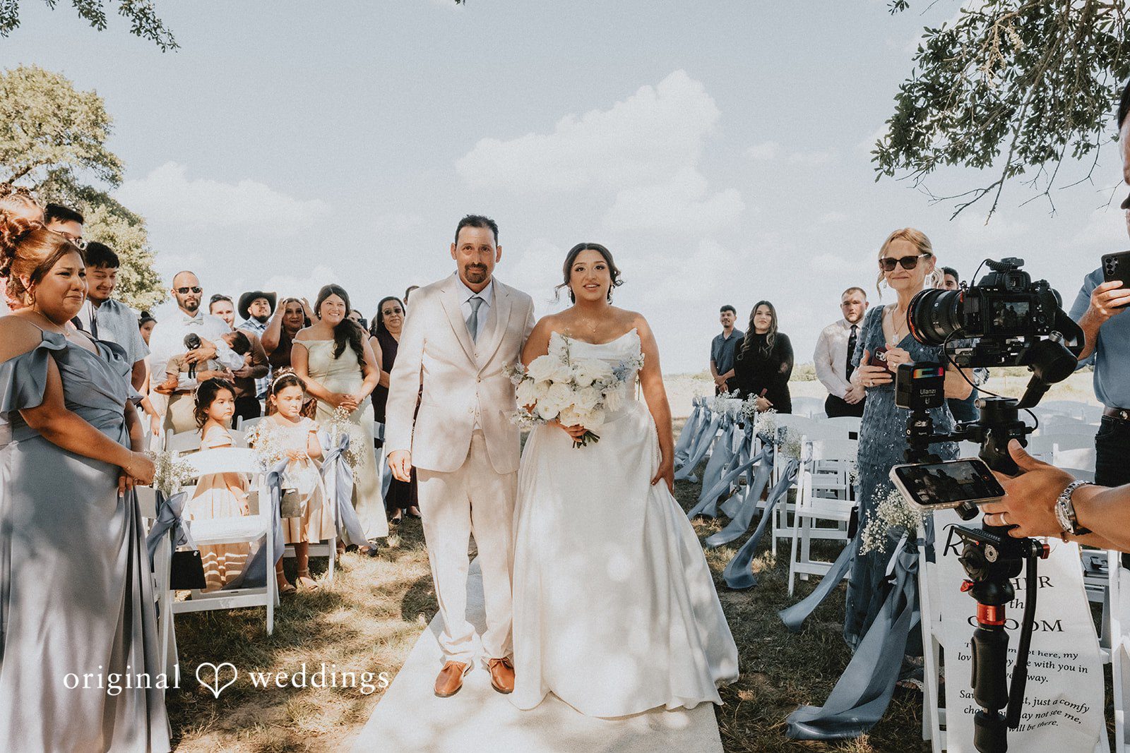 Briana + Joshua Bride walking down the aisle
