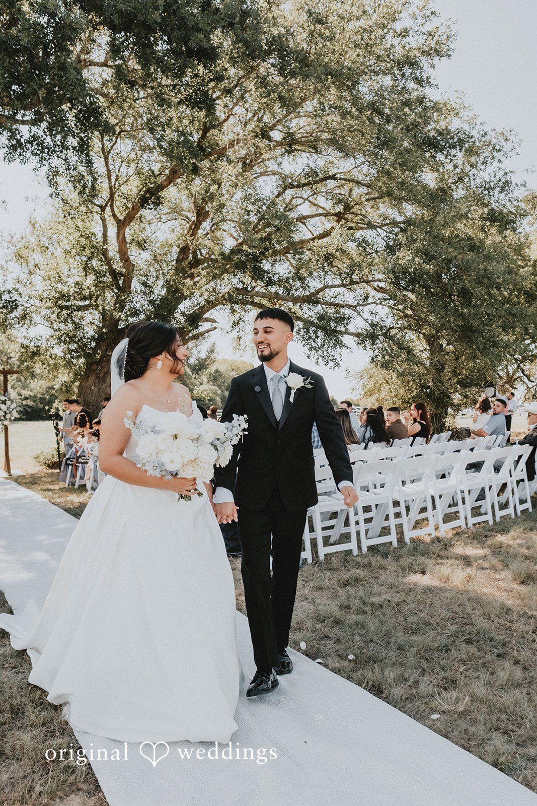Briana + Joshua Couple walking back up the aisle