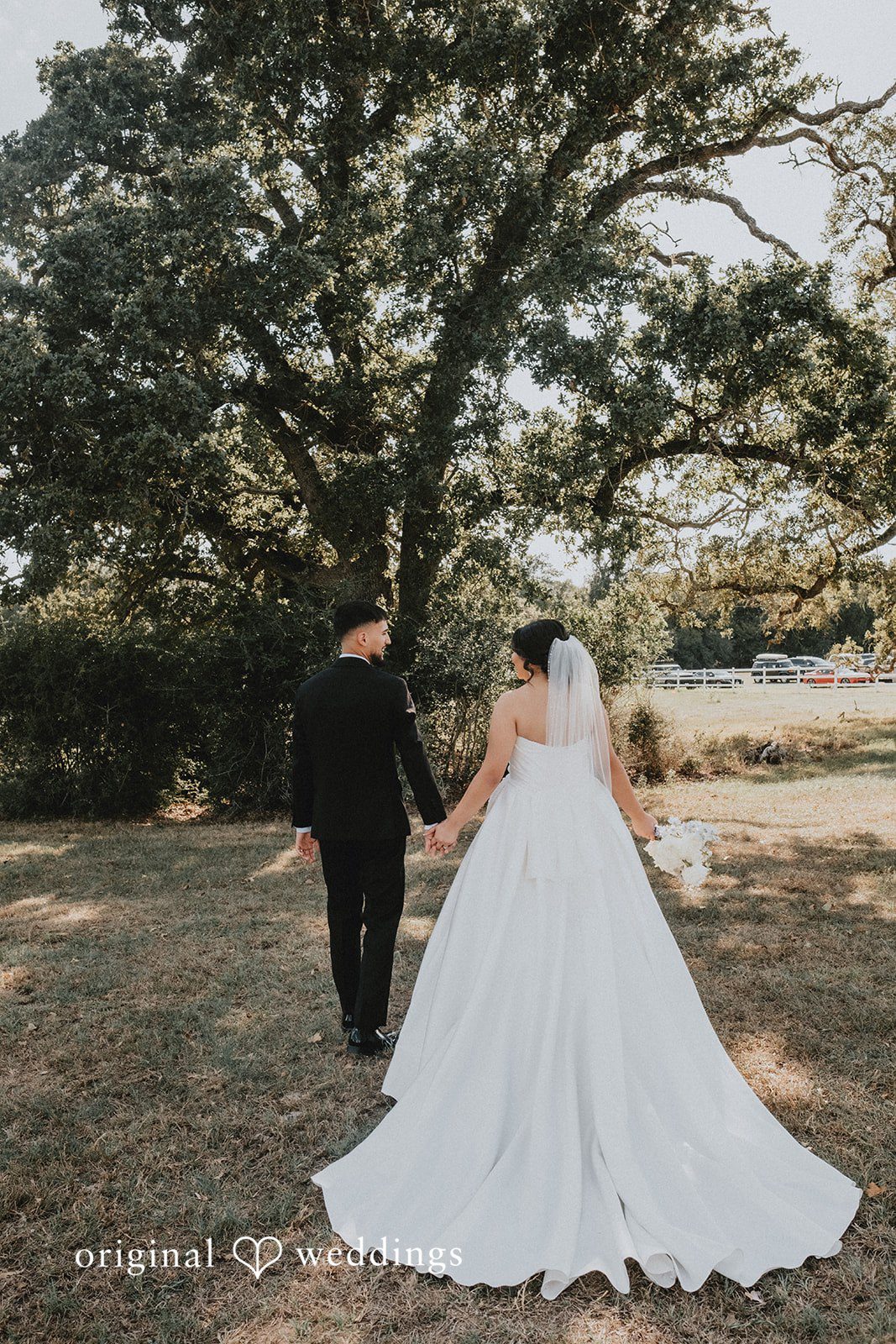 Briana + Joshua Couple walking under the oak