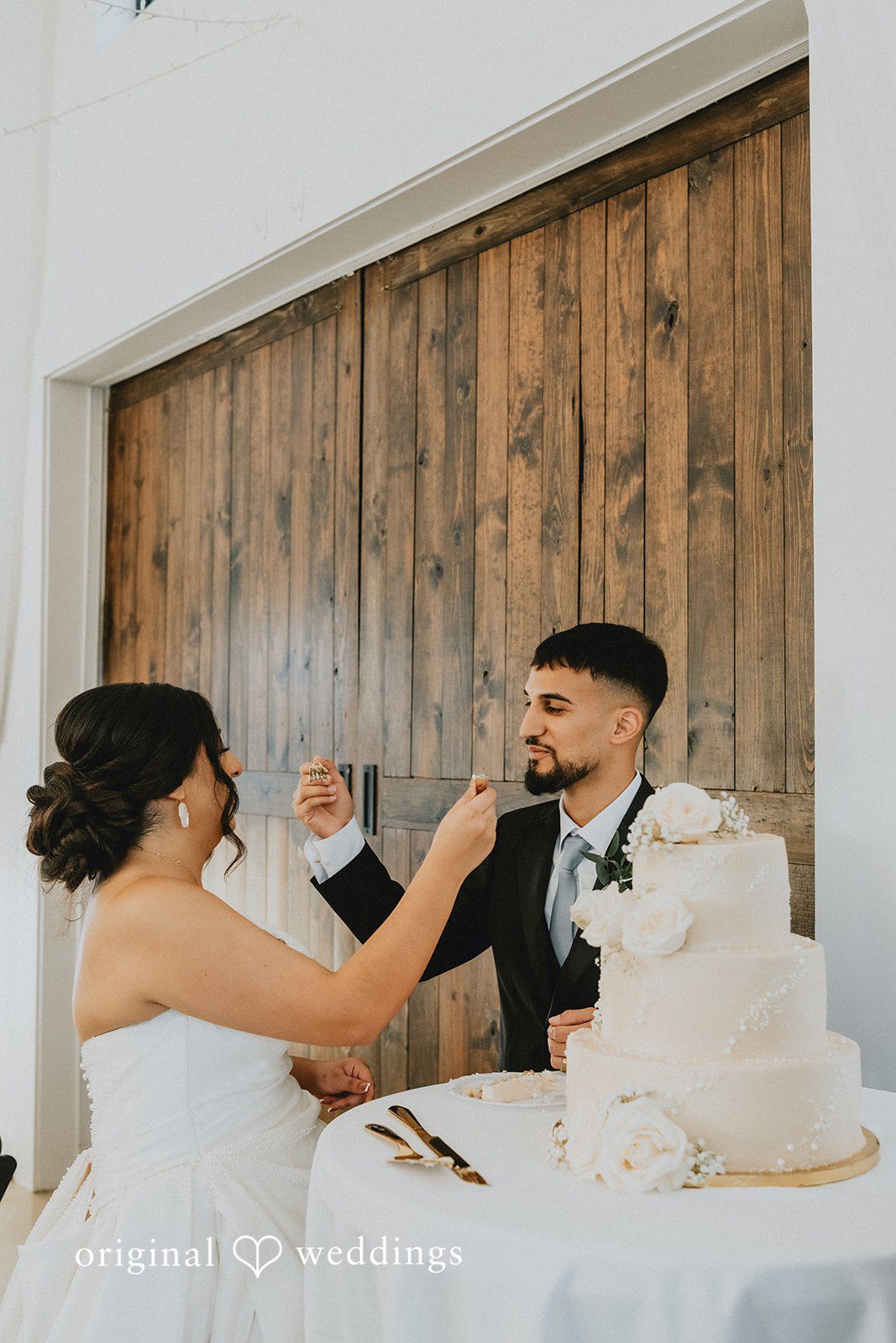 Briana + Joshua Couple cutting the cake