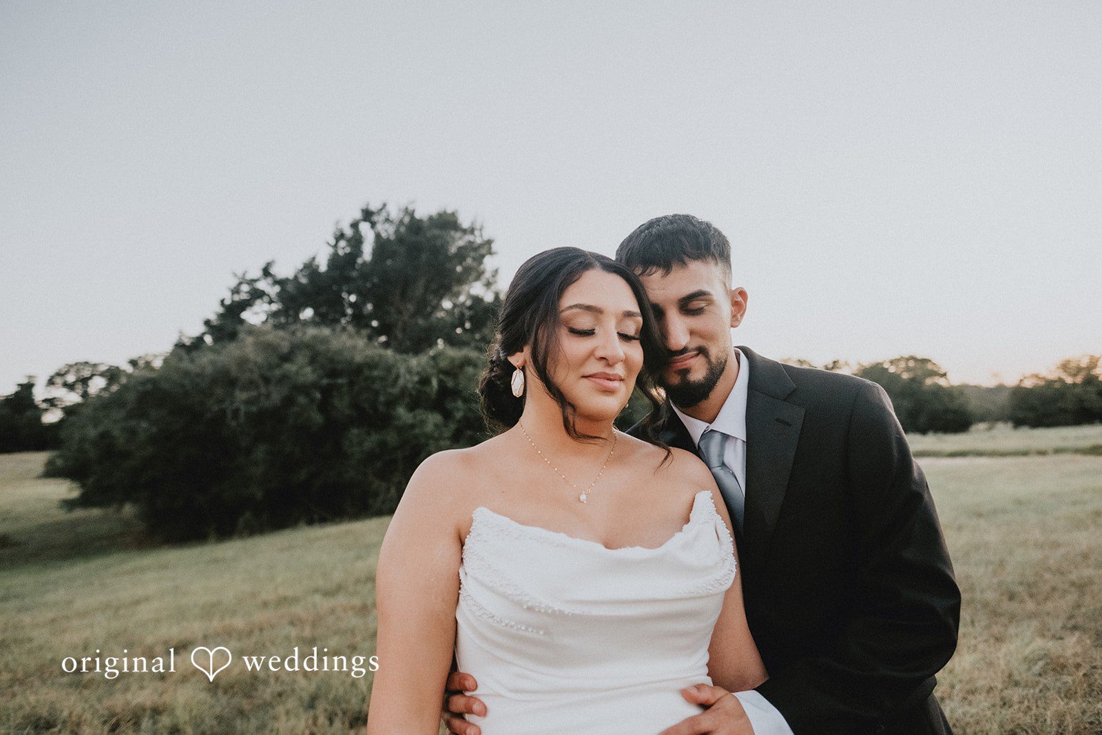 Briana + Joshua Couple close in the field, captured by Austin wedding photographers from Original Weddings at Always Timeless Barn