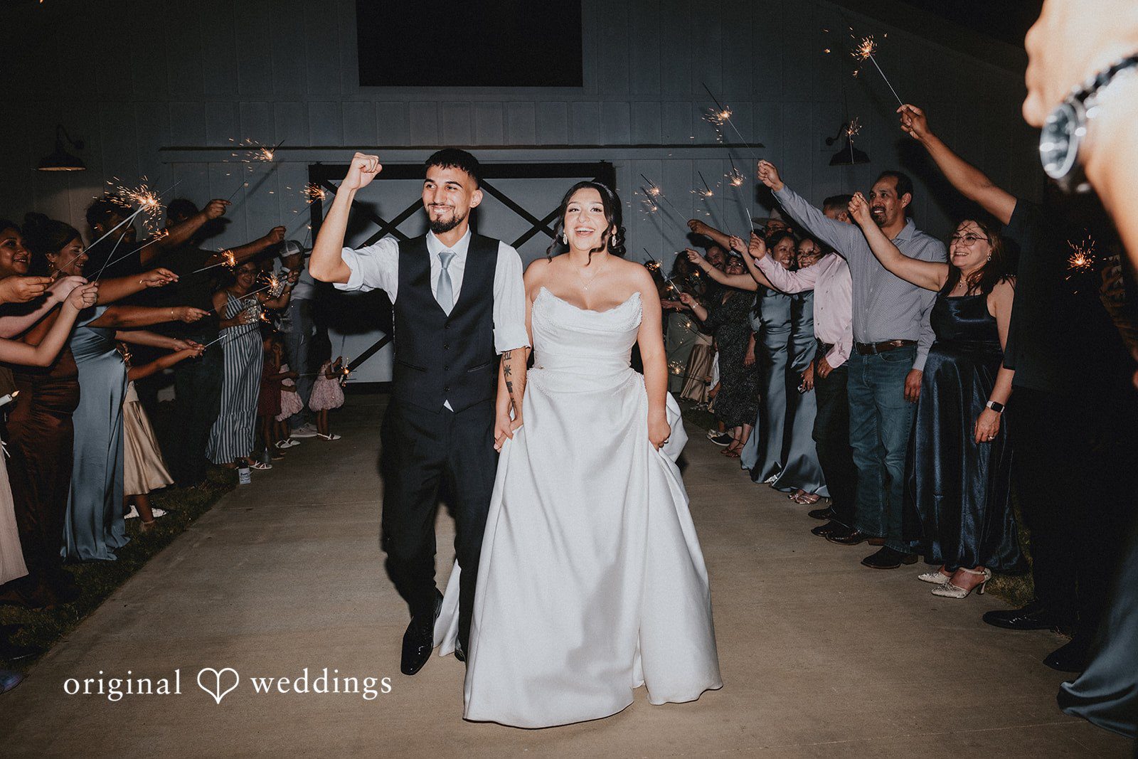 Briana + Joshua Couple exiting through the guests