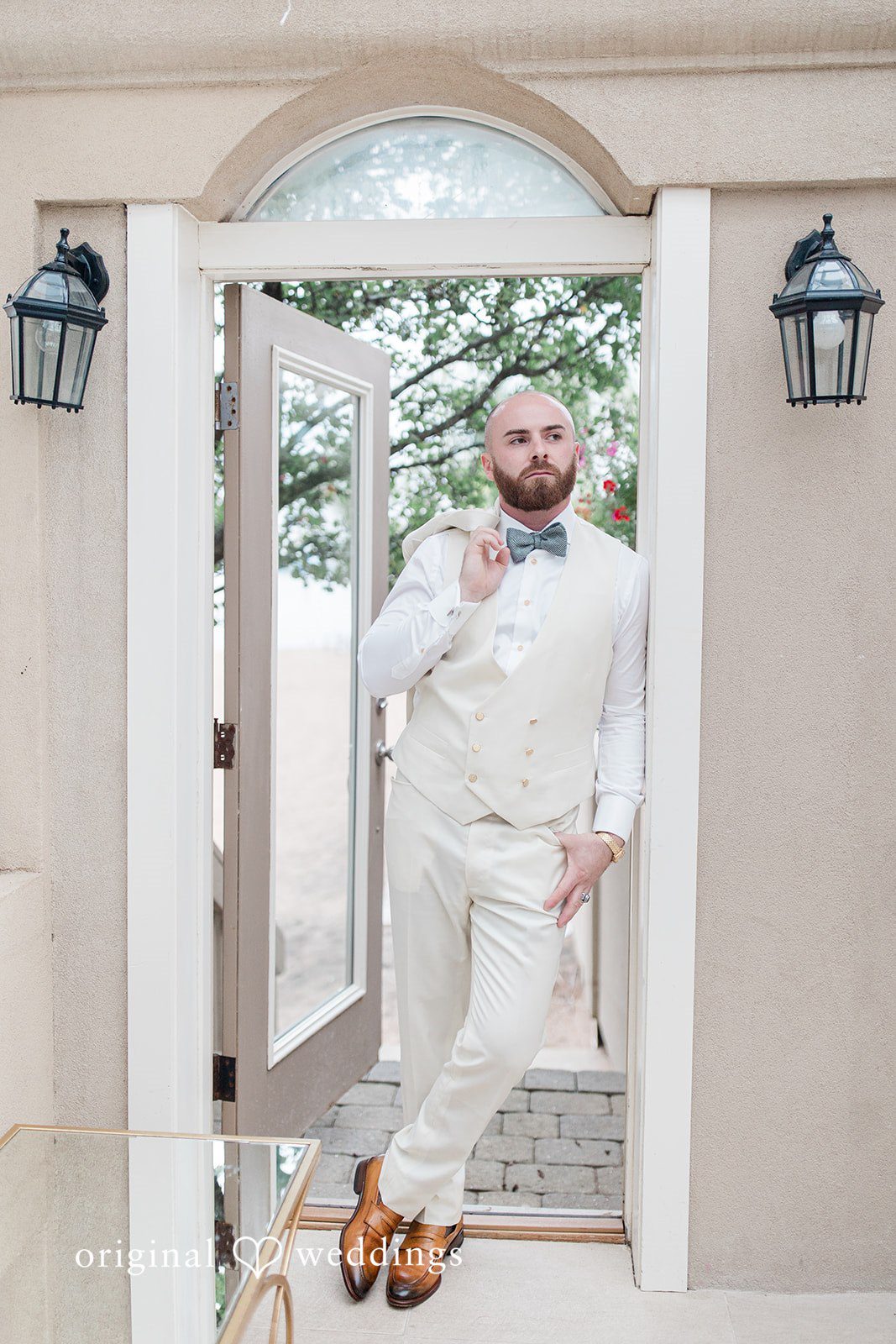 Jackie + Will Groom standing in the doorway at Anthony's Ocean View