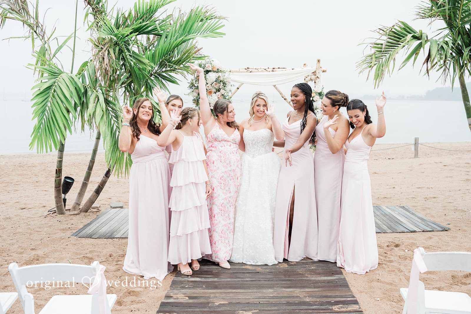 Jackie + Will Bridesmaids in blush dresses on the beach