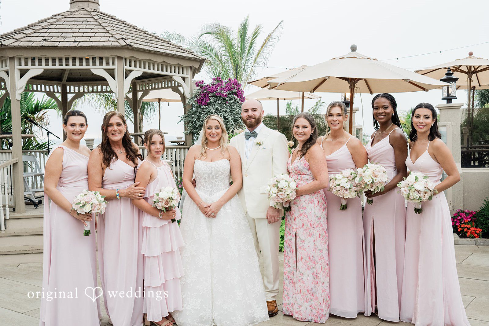 Jackie + Will Bride with her bridesmaids under the gazebo at Anthony's Ocean View
