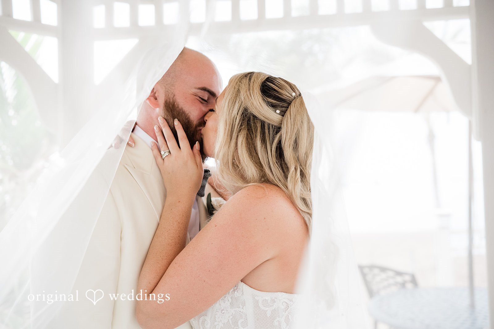 Jackie + Will Couple kissing in soft window light