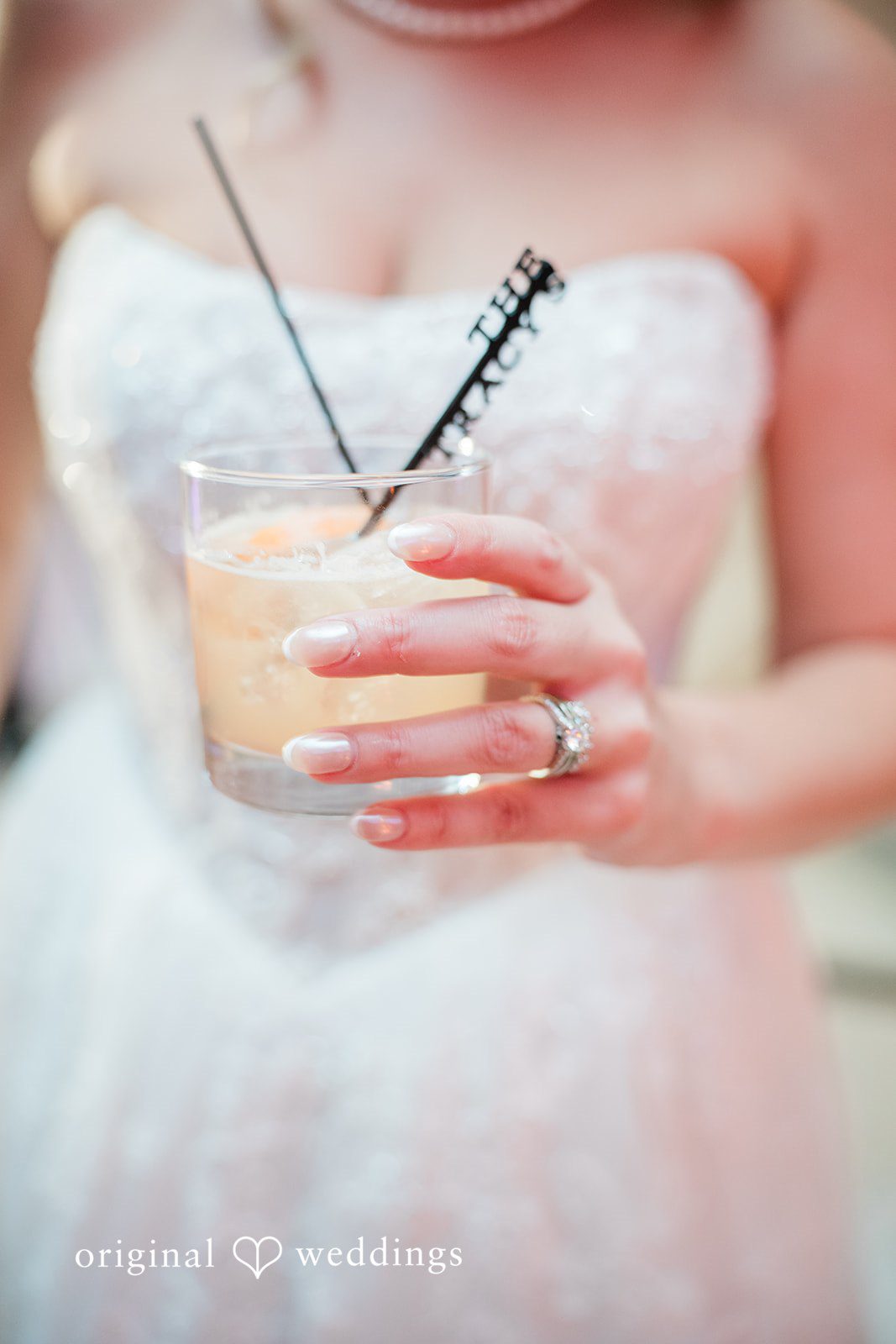 Jackie + Will Bride holding a cocktail at the reception