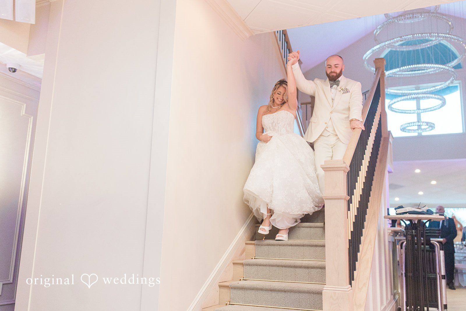 Jackie + Will Bride walking down the staircase in her gown
