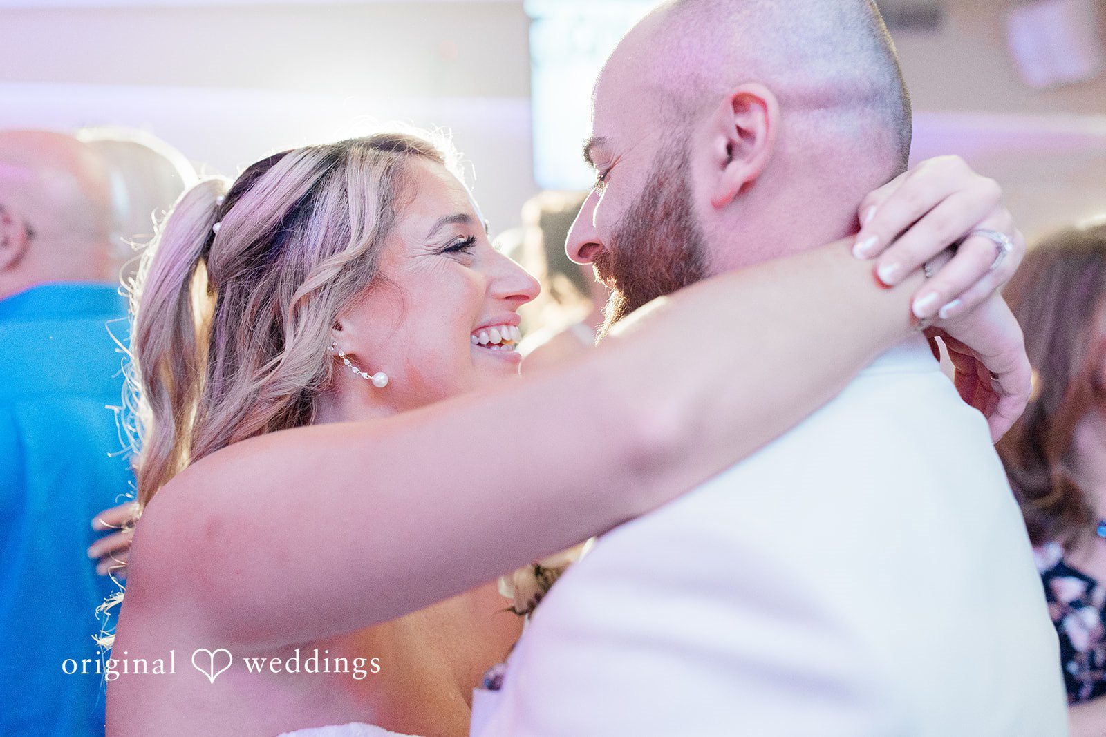 Jackie + Will Bride and groom hugging on the dance floor
